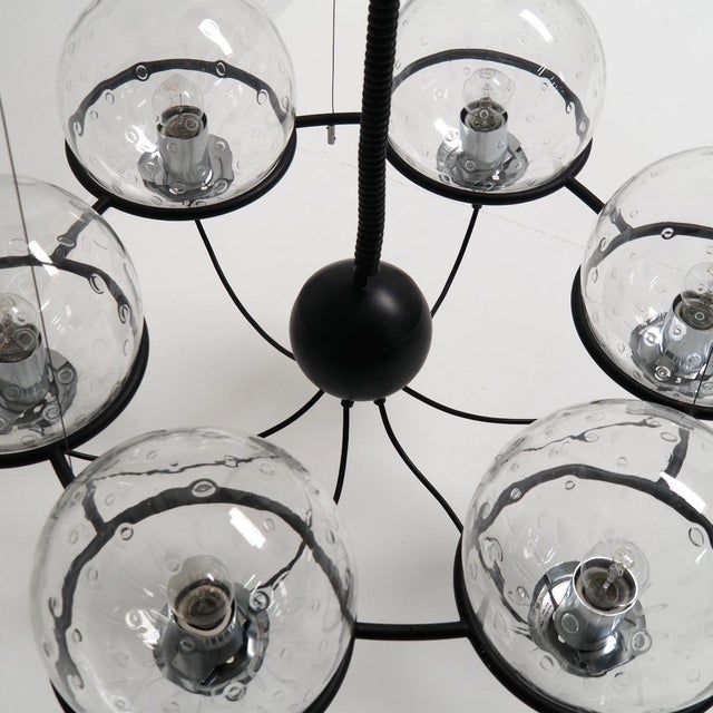 Look at this RAAK “Saturnus” chandelier from the 1960s, presented in outstanding condition. The composition consists of...