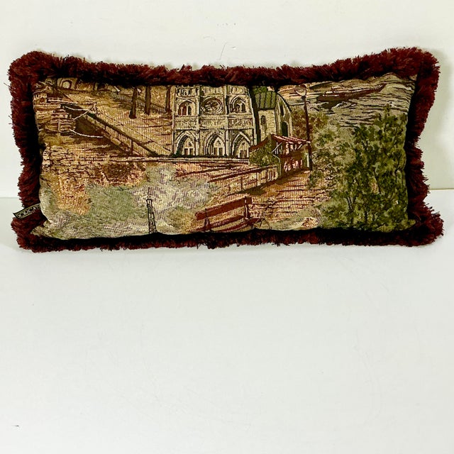 This is a wonderful lumbar decorative pillow from the 1980s. It features a tapestry style front with European city scenes....