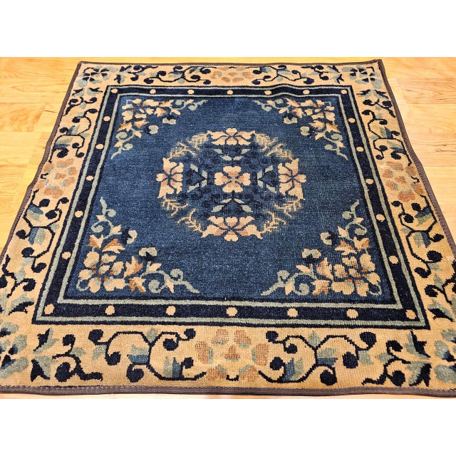 This rare 19th century Chinese Peking area rug features a unique square format, making it a prized find for collectors and...