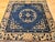 This rare 19th century Chinese Peking area rug features a unique square format, making it a prized find for collectors and...