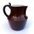 Lovely antique Sarreguemines one-handled pitcher with a warm brown glaze and clean white interior. Marked “Sarreguemines”...