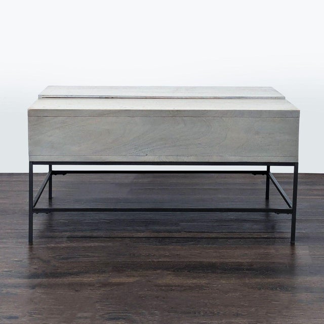 Industrial Storage Pop-Up Coffee Table by William Sonoma for West Elm. This wood coffee table offers an industrial profile...