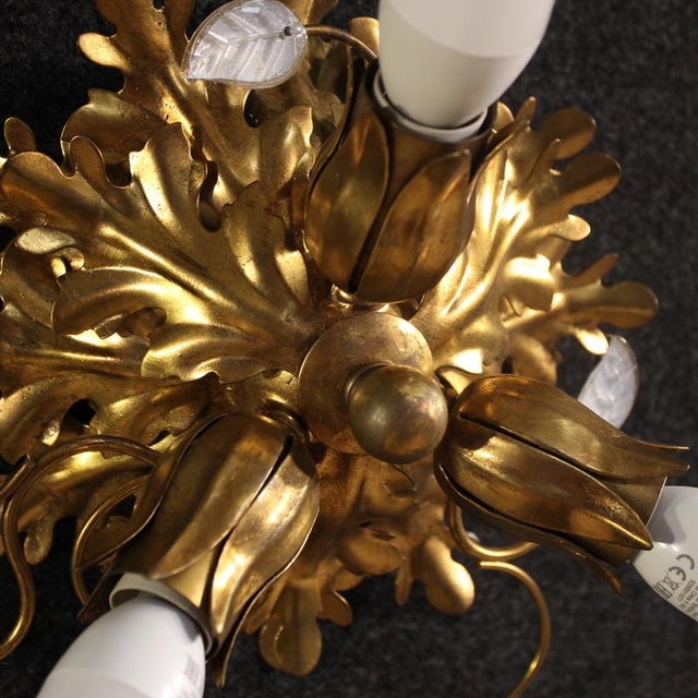 An elegant Italian flush-mount ceiling light from the second half of the 20th century. Crafted from gilt metal and adorned...