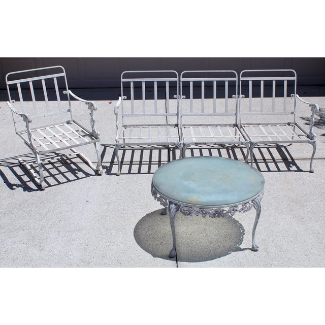 Hollywood Regency Vintage 1950s Cast Aluminum Patio Set | 5-Piece Outdoor Seating | Rocker Chairs + Bench + Glass Top Table | Hollywood Regency Garden Furniture For Sale - Image 3 of 18
