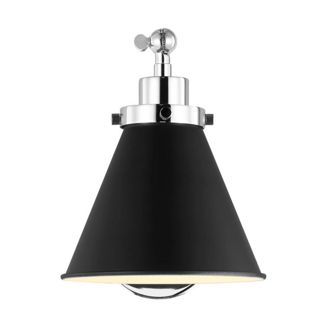 Inspired by various classic utility silhouettes - from factory lighting to barn sconces - capped by contrasting metal...