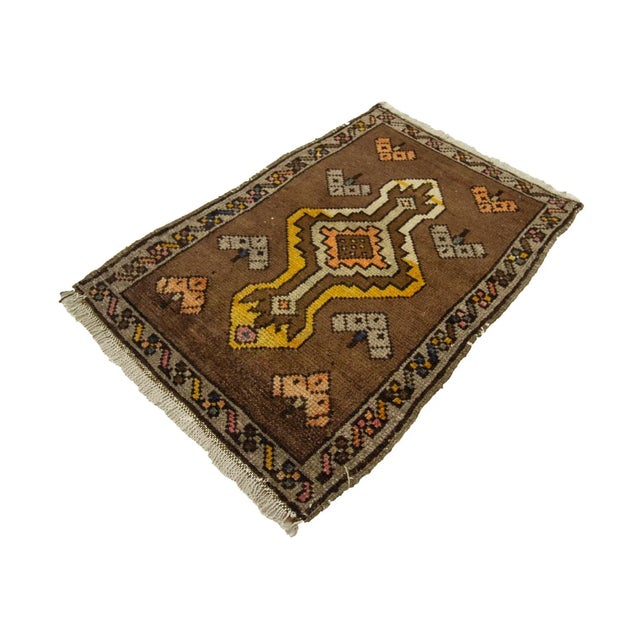 Vintage Handknotted decorative mini rug from Kars region of Turkey. Approximately 45-55 years old. In very good condition.
