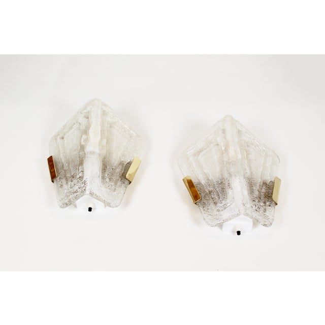 High-quality set of glass wall lamps with brass details by the German manufacturer Hillebrand. Both lamps are in very good...