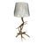 This distinctive table lamp features an authentic antler base with natural branching tines that create an organic,...