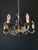 The chandelier is made of brass. It is adorned with bronze elements. Magnificent artistic wrought ironwork! the chandelier...