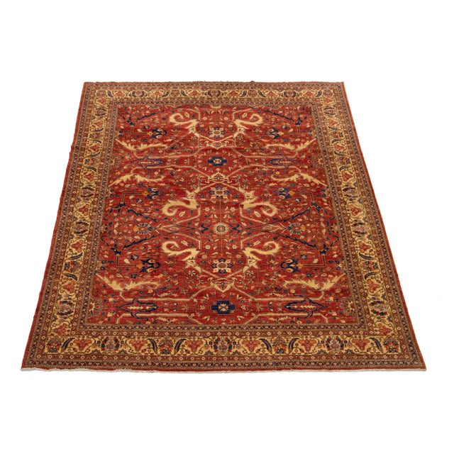 This stunning room-sized rug showcases a modern take on the classic Serapi style, expertly crafted from top-quality wool....