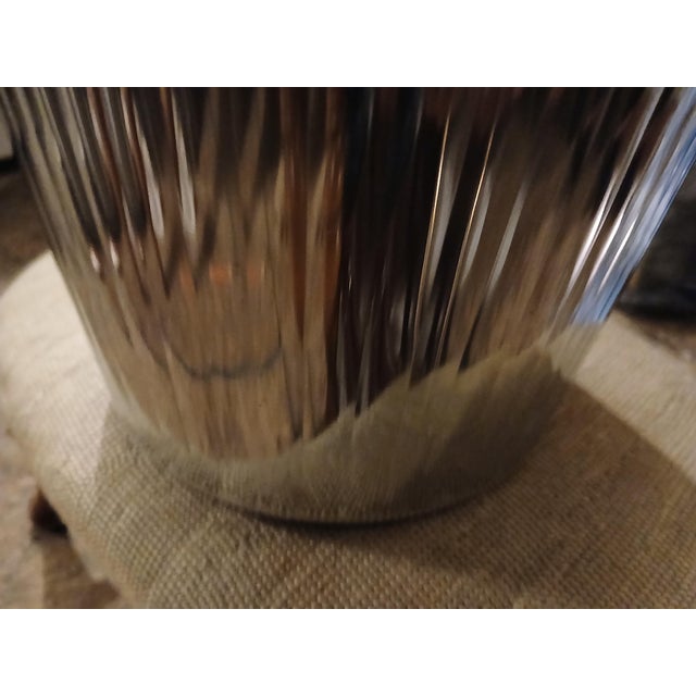 Fluted chrome plated 90s waste basket or trash bin. Beaded top and bottom edge. Minimal scratching to bottom and interior....