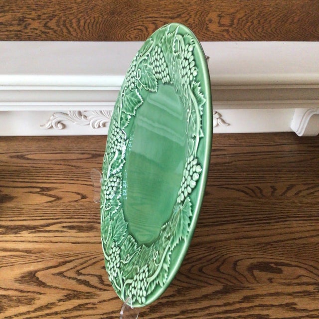Large 14 inch round Bordallo Pinheiro serving platter with grape and grape leaf border made in Portugal.