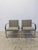 Pair of original Brno flat bar stainless steel and fabric arm chairs designed by Mies Van Der Rohe and manufactured by...