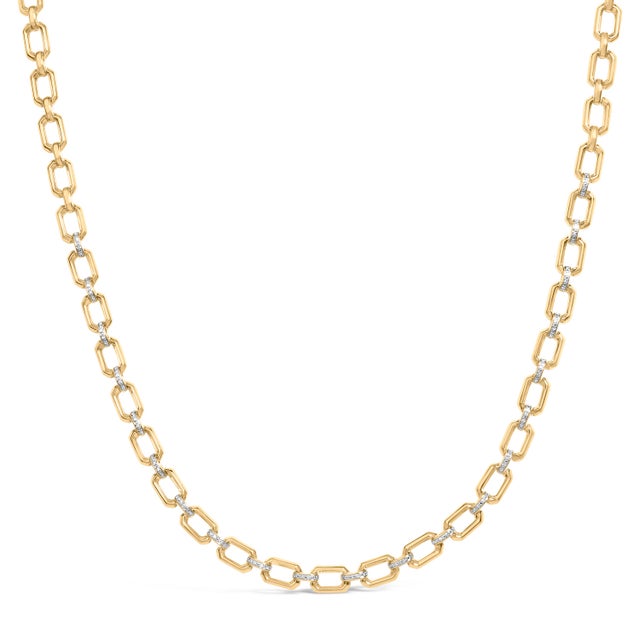 Sculptural and luminous, this statement chain turns geometry into poetry. Bold, open octagonal links, mirror-finished in...