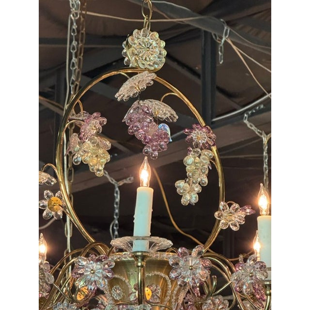 The Vintage French Maison Bagues Crystal and Amethyst Flower Basket Chandelier is a stunning fixture that adds a touch of...