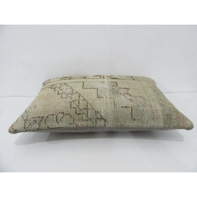 Decorative pillow cover made from a vintage Turkish handknotted rug. Backed with good quality cotton fabric. Pillow...