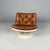 Italian Space Age brown leather and white plastic armchair by Play, 1970s. Swivel armchair with round white plastic base....