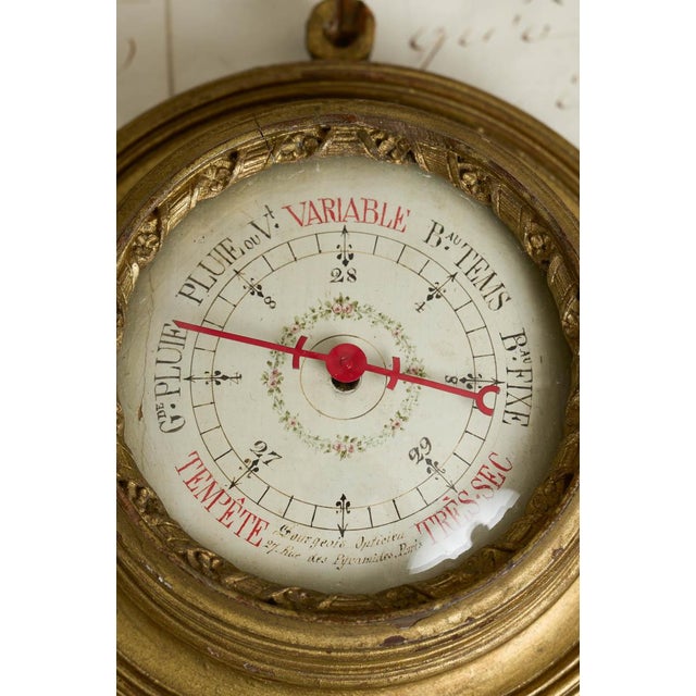 A beautiful French giltwood barometer, dating to the late 19th century. The lovely piece is marked 'Bourgeois Opticien/27...