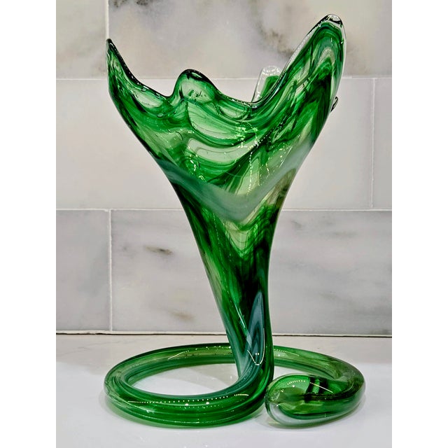 This sculptural emerald and milk glass handkerchief vase brings a dramatic mid-century modern flourish to any vignette....