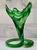 This sculptural emerald and milk glass handkerchief vase brings a dramatic mid-century modern flourish to any vignette....