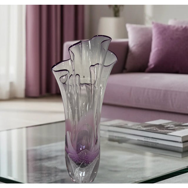 This elegant 11 3/4-inch hand-blown 24% lead crystal vase, designed by renowned Polish glass artist Adam Jablonski, is a...