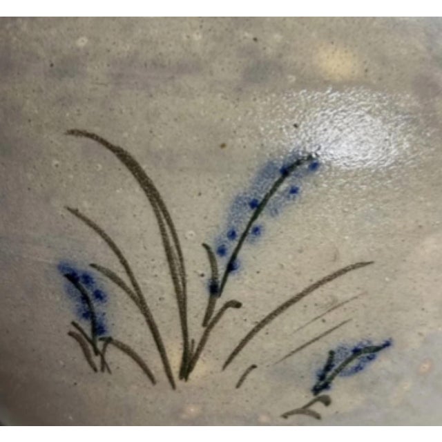 A wonderful piece of North Carolina pottery by M.L. Owens, this hand-thrown stoneware jug dates to 1988 and reflects the...