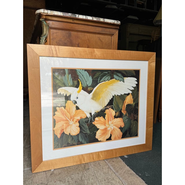 Beautiful vintage tropical bird artwork featuring a striking white cockatoo with a golden-yellow crest, perched among lush...