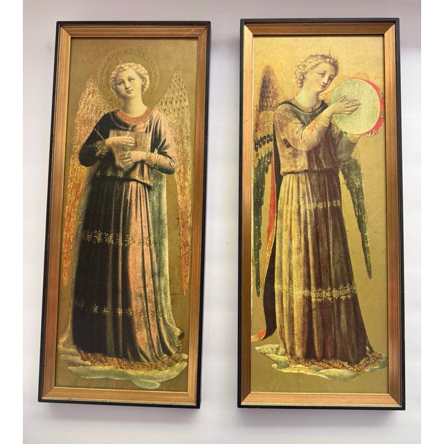 A pair of vintage framed reproduction prints depicting Renaissance musician angels against luminous gold grounds. One...