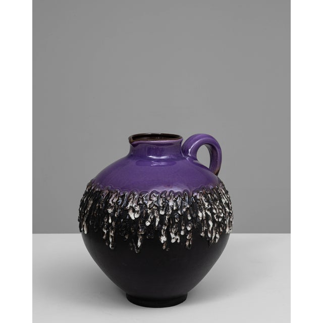 This 20th-century German Fat Lava ceramic jug embodies the bold, expressive aesthetic that defined West German pottery in...