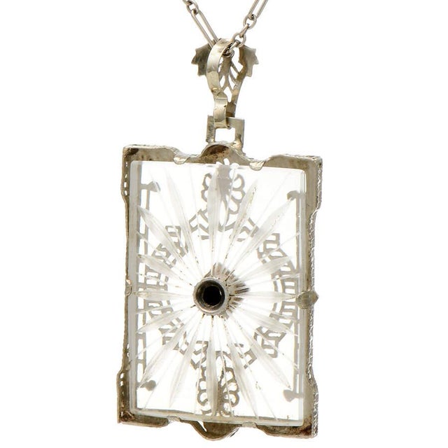 When you're seeking out a prestigious piece that sparks curiosity, this incredibly elegant Edwardian rock crystal pendant...