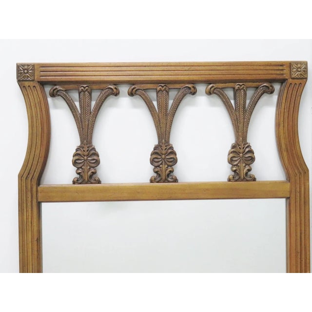 Fruitwood carved frame with plume crest.