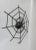 A wall decoration "spider on the net" from the 50s made of iron painted black. The object is handmade, the body and the...