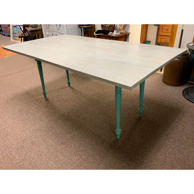 20th century harvest table , no makers mark. Sturdy , has been pained in two tone blue colors cnter is 20”, each fold down...