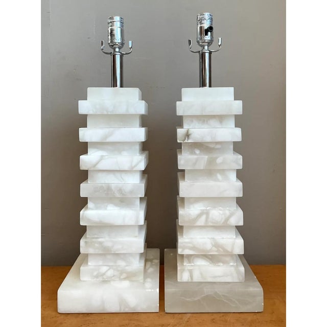 Crafted from solid polished natural alabaster stone, this vintage pair of table lamps features a striking architectural...