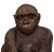 Vintage composite seated monkey figurine. Features a mother and child depiction and finished with a black round marble...