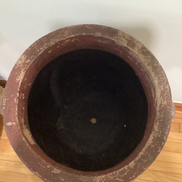 This Antique Rustic Patinated Double-Handled Large Terracotta Planter/Vessel is a handmade decorative collectible suitable...