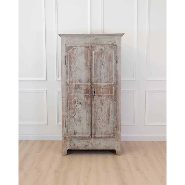 Made in France in the eighteenth century, this small painted pine cabinet comes from Uzes, in the south of France, and...