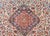 A wonderful early 20th century Persian Kashan rug with a large central floral medallion living amidst a field of even more...