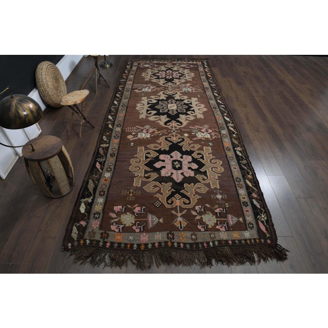 Vintage Turkish Hand-Knotted vintage rug is a semi-antique vintage runner rug. The '70s Eastern region of Turkey's unique...