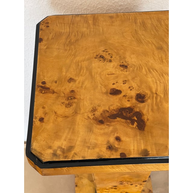 Gorgeous Art Deco pair of plant or sculpture stands in Birds Eye veneer with ebonized accent.