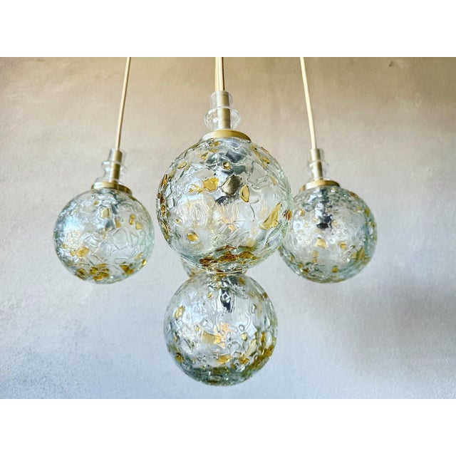 Beautiful mid-century design. Cascade pendant lamp made in the 1970s by German company Doria Leuchten. 6 thick-walled...