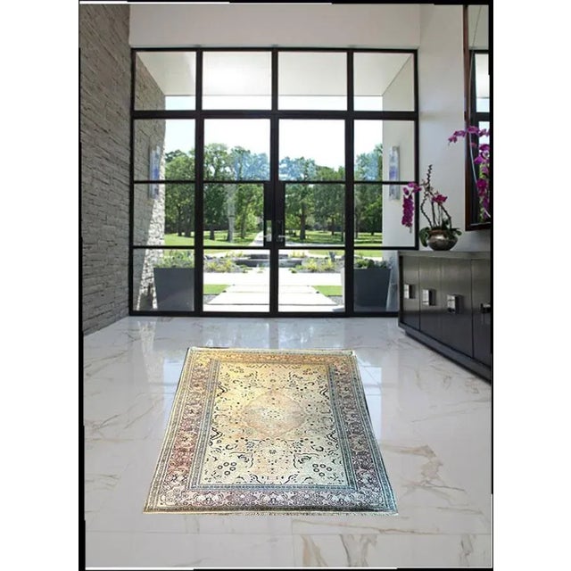 A very high quality vintage 100% silk Chinese area rug. It has a very nice simple floral pattern on top of nice pale color...