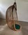 Beautifully shaped hanging basket, lounge chair in woven rattan. this hanging swing chair with a sculptural rattan...