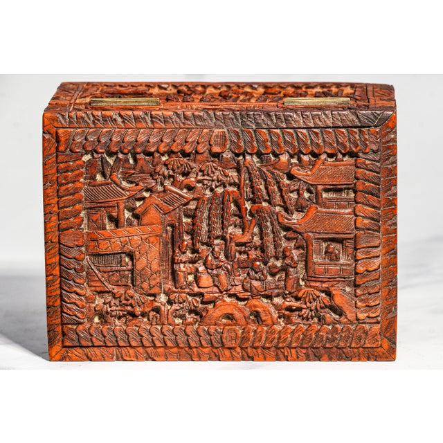 An exceptional example of 19th-century Chinese carving, this beautifully handcrafted hardwood box is richly decorated on...