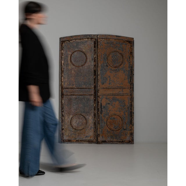 This 1900 - 1909 door from France is finished in chocolate, worked in iron. Its form follows honest, well-proportioned...
