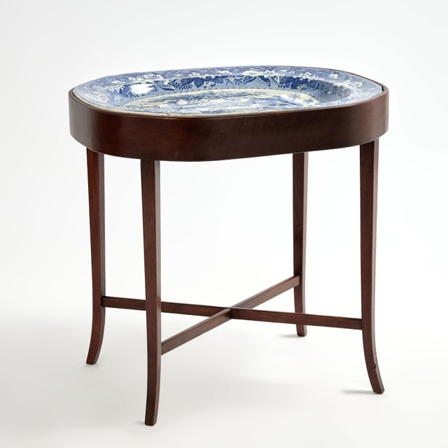 Standout 19th Century English blue and white tray transfer decorated with tree, boats and figures inside a floral border,...