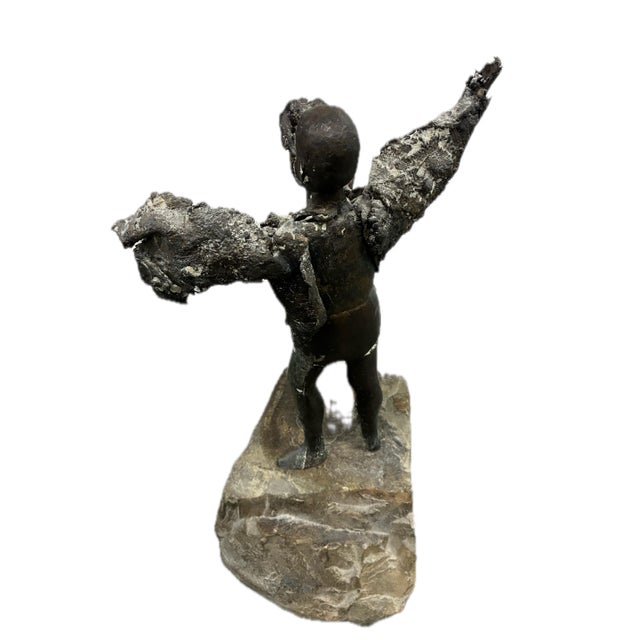 A sculpture possibly depicting Icarus by American sculptor Simon Toparovsky who works in both bronze and cast iron. This...