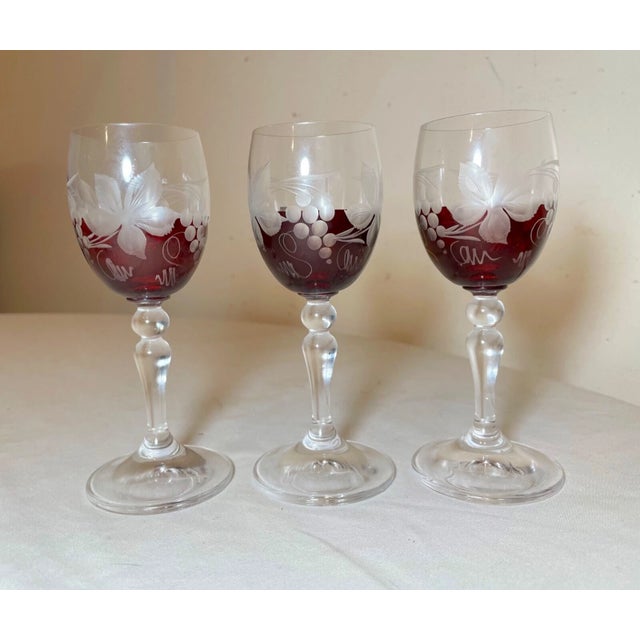 Up for sale is a wonderful lot of three antique cut to clear Moser cordial shot glasses. They're made of a red and clear...