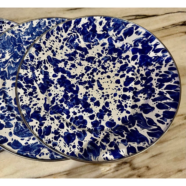 Set of six vintage early 1980s hand made with different shades of blue and white sponge-ware style metal enameled plates,...