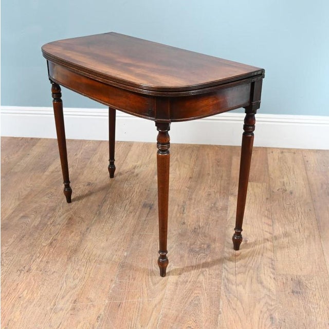 William IV early Nineteenth Century D end card table The tables opens to reveal a baize playing surface in good condition....